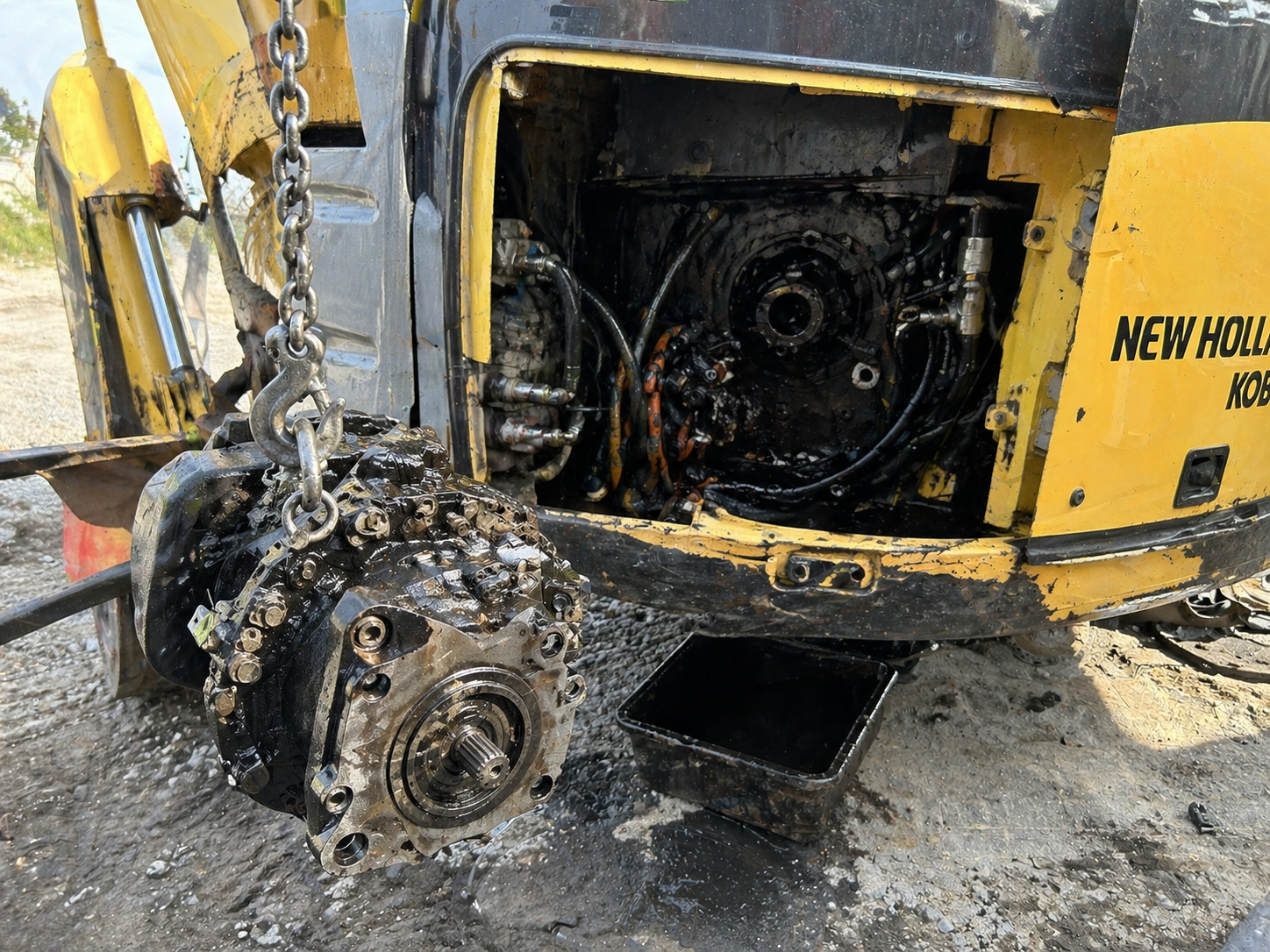 New Holland excavator hydraulic main pump removed for replacement